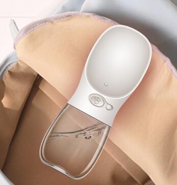 Portable One-Touch Pet Water Bottle in teal standing upright on teal gradient background, full product view